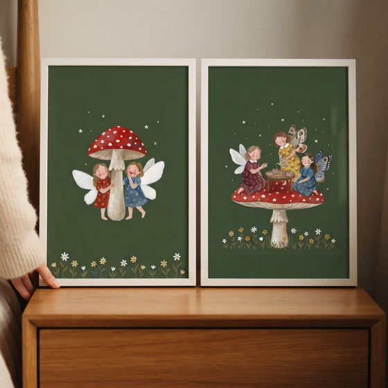 Starry dark forest fairies wall art set of 2 featuring fairies having tea and red mushrooms on a dark green background.
