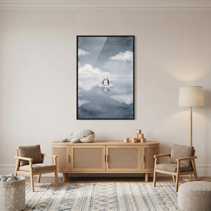 Starry night sky penguin wall art above a wooden sideboard with a whale plush, two small wooden chairs, and a floor lamp.