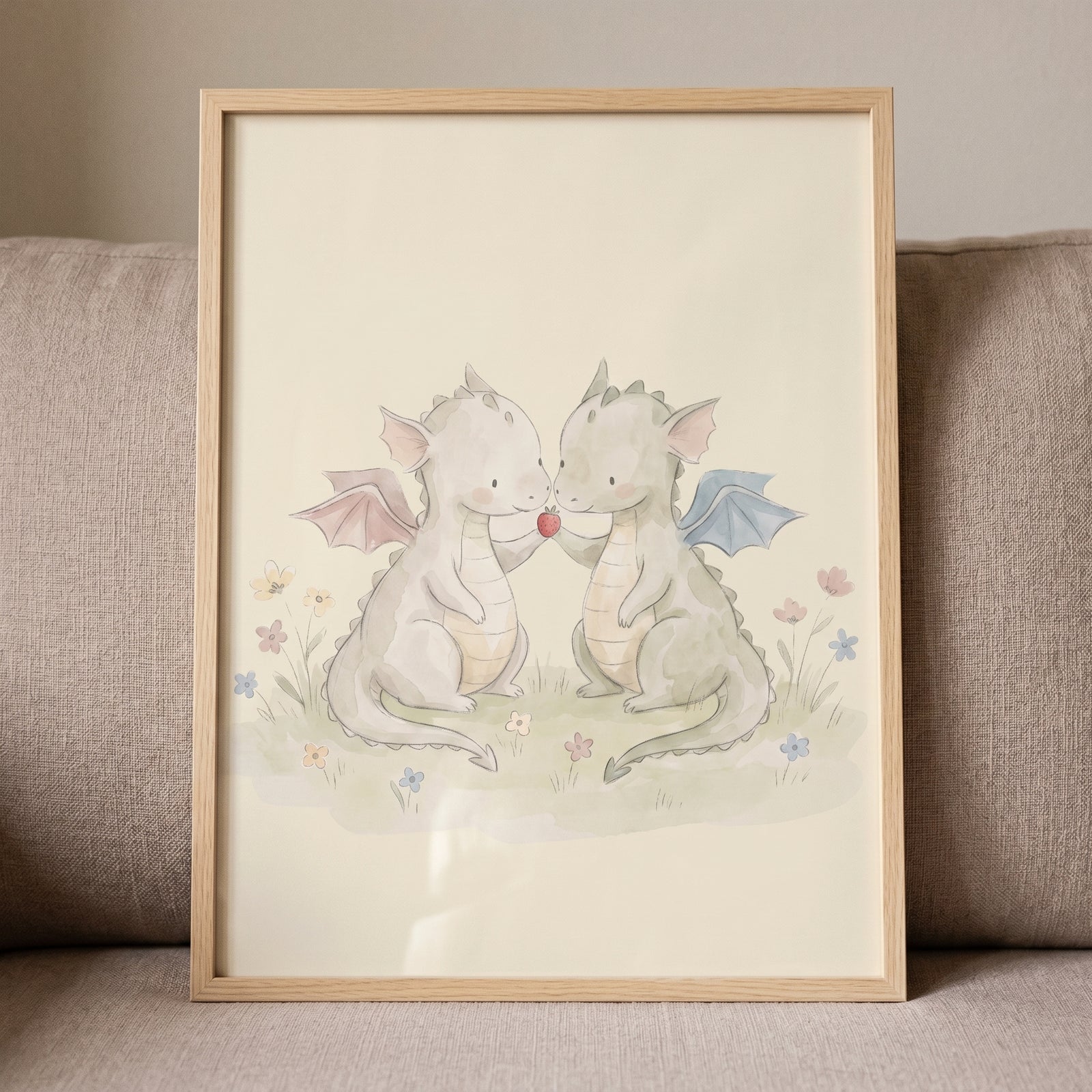 Strawberry sharing baby dragons wall art shows two watercolor creatures holding a strawberry in a field of flowers.