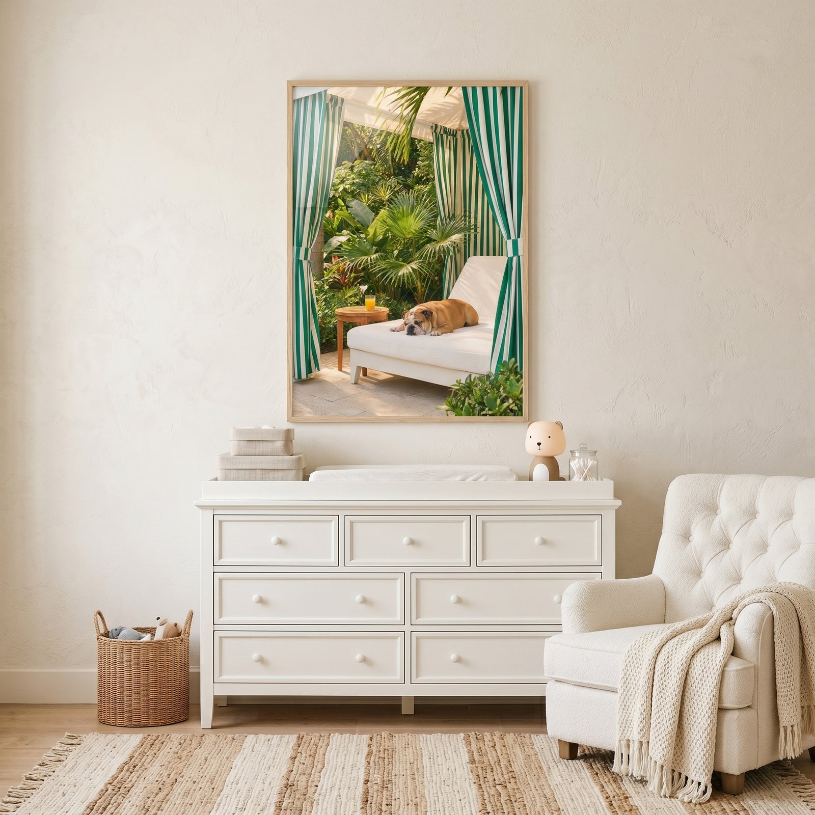Striped cabana sleeping bulldog wall art on a white dresser shows a dog on a lounge chair near a glass of orange juice.