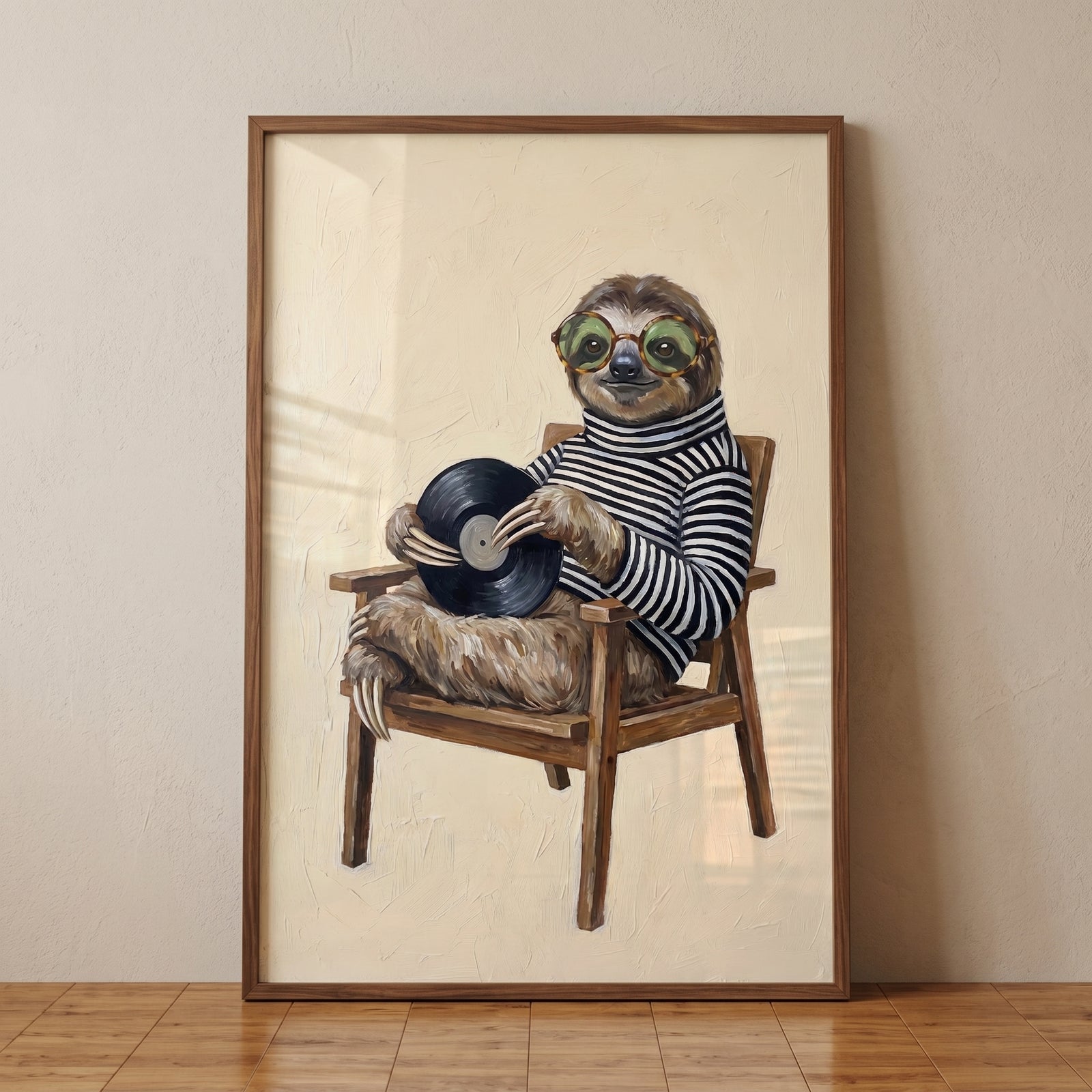 Striped sweater wearing sloth wall art with a sloth in glasses sitting on a wooden chair holding a vinyl record.