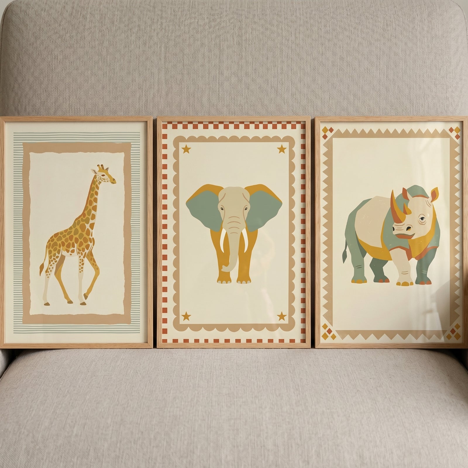 Stylized folk safari animal wall art set of 3 featuring giraffe, elephant, and rhino prints in light wooden frames.