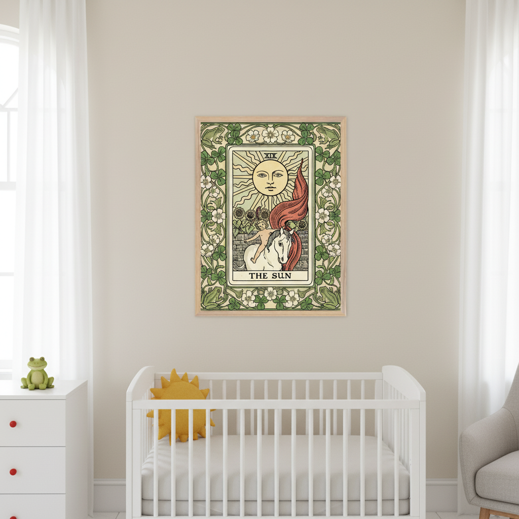 Nursery with a white crib, white dresser, and gray armchair. A framed print of 'The Sun' tarot card, showing a child on a white horse under a sun with a green floral border, hangs on the beige wall above the crib.