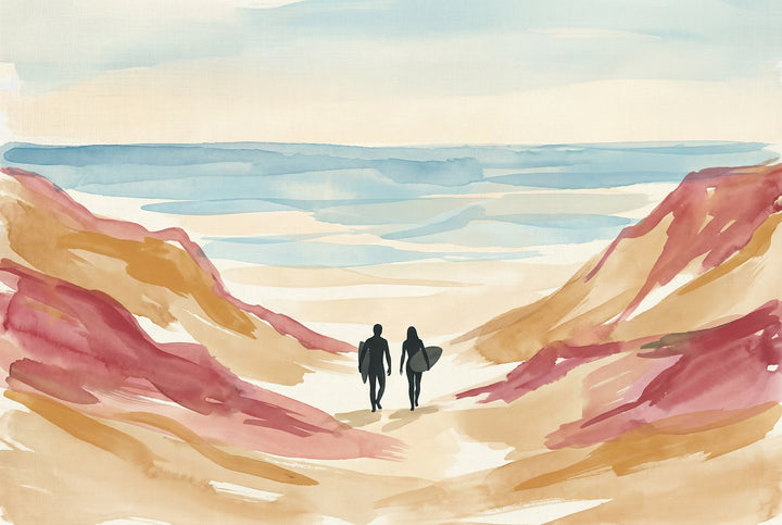A man and a woman with surfboards walk through a sandy canyon toward the sea, with watercolor washes of blue, tan, and coral forming the cliffs and shore.

