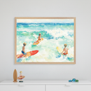 Kid's room with a white dresser. A large framed watercolor print of three boys surfing in turquoise ocean hangs centered above the dresser. A wooden surfboard, a boy figurine, and glass gems are on the dresser.