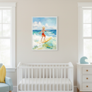 Modern nursery with a white crib, light blue armchair, and white dresser. Above the crib, a framed watercolor-style painting shows a blond boy in red shorts surfing on a yellow board amidst blue and green waves.