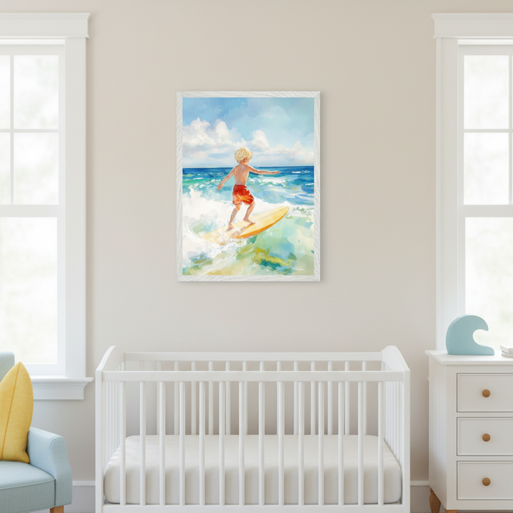 Modern nursery with a white crib, light blue armchair, and white dresser. Above the crib, a framed watercolor-style painting shows a blond boy in red shorts surfing on a yellow board amidst blue and green waves.
