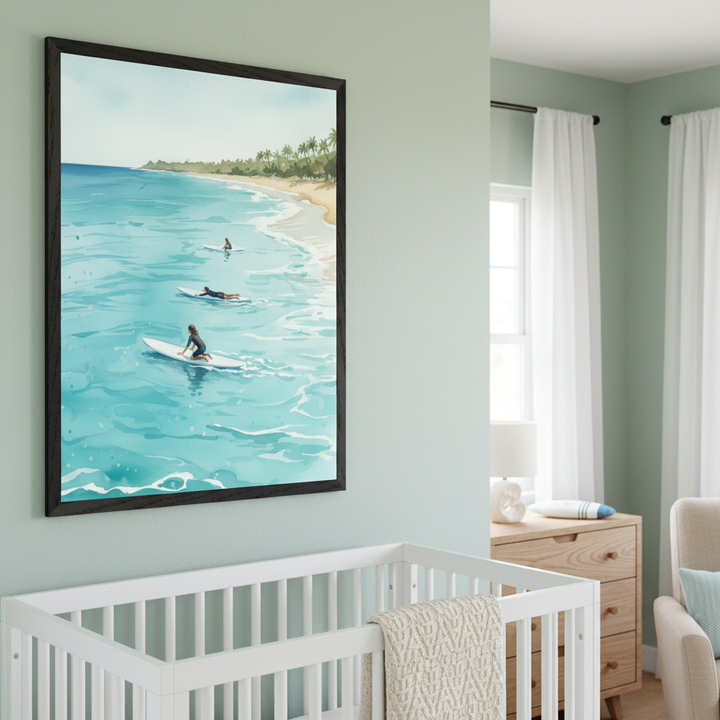 Modern nursery with light green walls. A large black-framed watercolor painting of surfers on a tropical beach hangs above and to the left of a white crib. A wooden dresser and an armchair are also visible.
