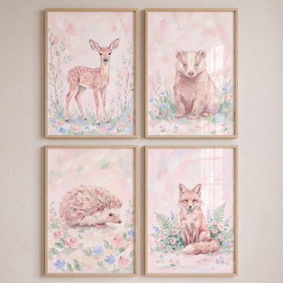 Sweet pink forest animals wall art set of 4 featuring a fawn, badger, hedgehog, and fox in light wood frames.