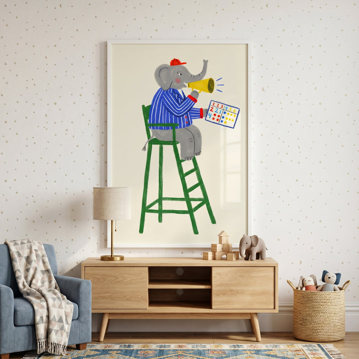 Framed tall green chair elephant artwork above a wood console with a blue armchair and star-patterned wallpaper.