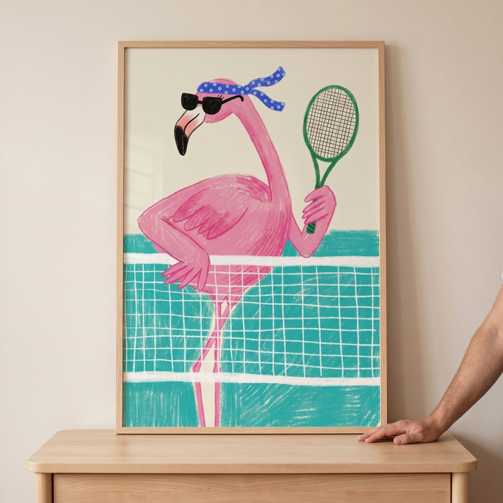 Tennis playing pink flamingo wall art with a flamingo wearing sunglasses and a headband holding a green racket at a net.