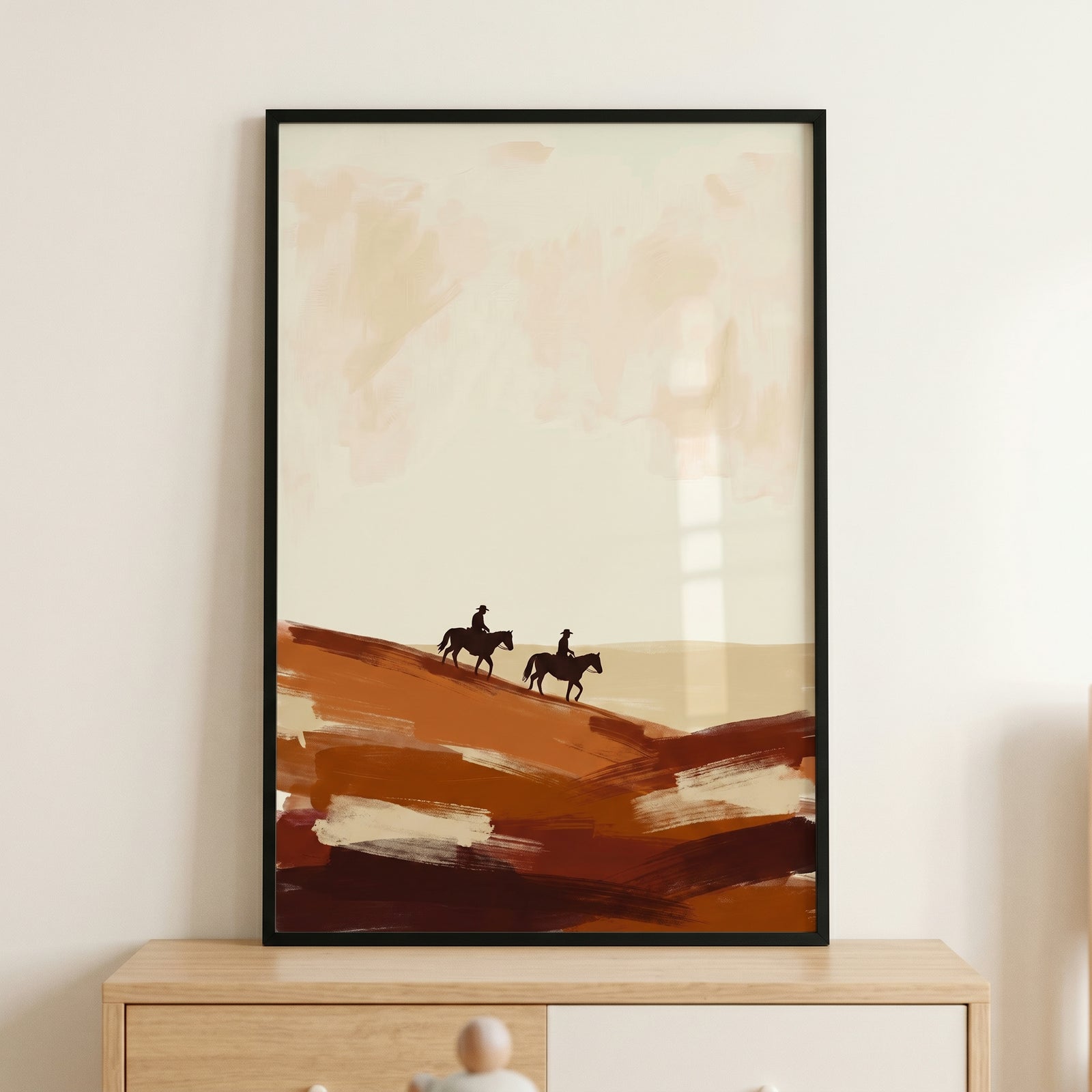 Textured brushstroke desert cowboy wall art with two horse riders on earthy brown hills against a minimalist beige sky.