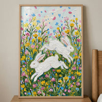 A textured impasto artwork captures two white rabbits in mid-leap through a vibrant meadow. The scene is rendered with thick, tactile strokes, giving the subjects and the environment a sense of movement and depth. The rabbits are surrounded by a dense field of yellow and pink wildflowers nestled among green leaves.