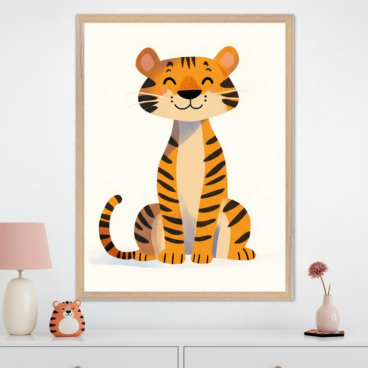 Modern kid's room with a white dresser. A large light wood framed print of a happy cartoon orange tiger sitting is centered above the dresser. A pink lamp and small tiger decoration are on the dresser.