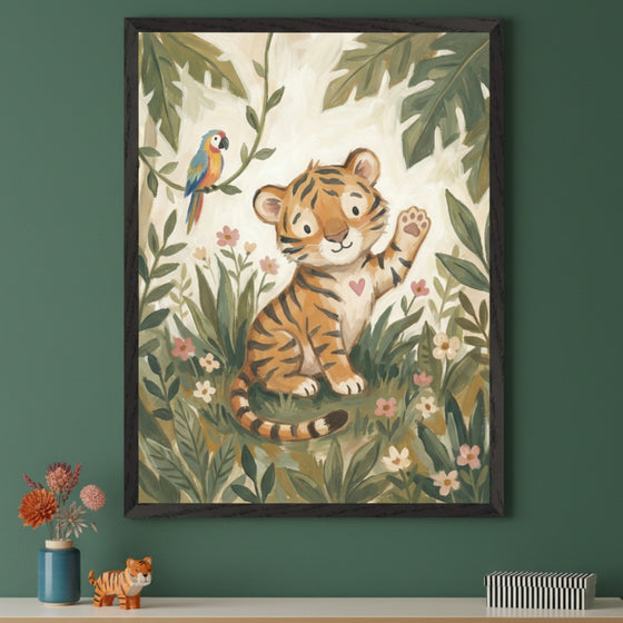 Modern room with a dark green wall. A framed illustrative painting of a cute tiger cub waving, with a parrot and jungle foliage, hangs above a white shelf. On the shelf are a blue vase with flowers, a small tiger figurine, and a striped box.