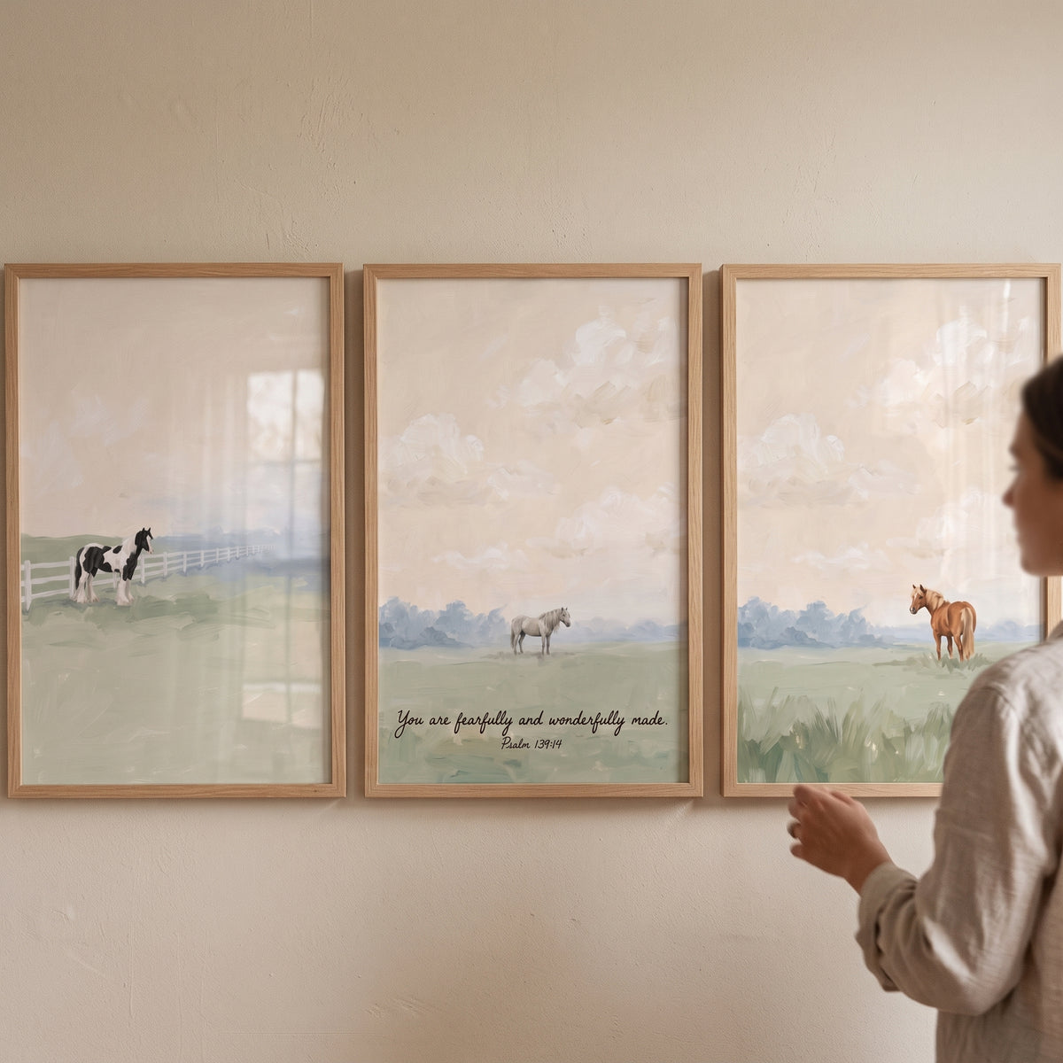 Triptych peach sky horse wall art set of 3 features horses in fields under a soft sky. One frame has scripture.