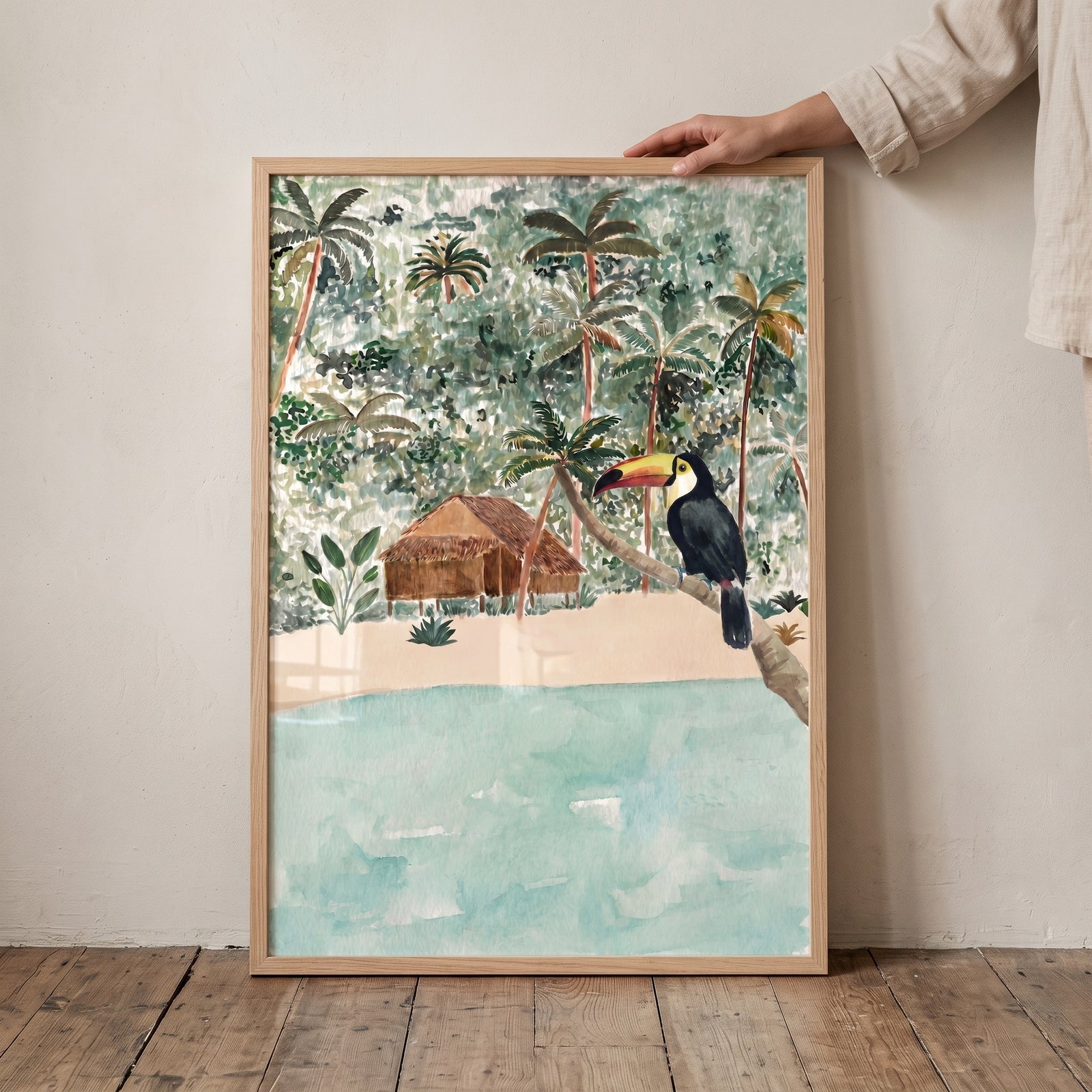 Tropical boho toucan wall art features a toucan on a branch, a beach hut, and palm trees in a jungle setting.
