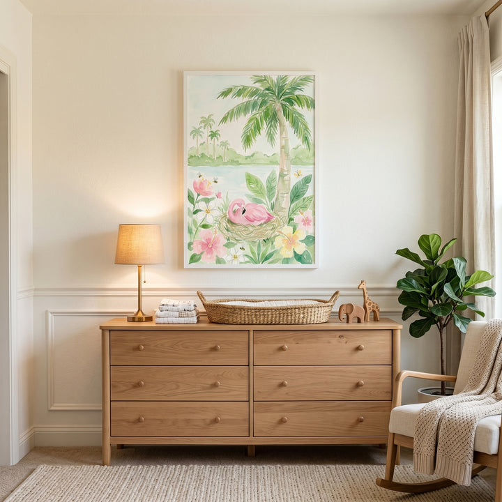Tropical hibiscus pink flamingo wall art above a wood dresser in a nursery with a rocking chair and a potted plant.