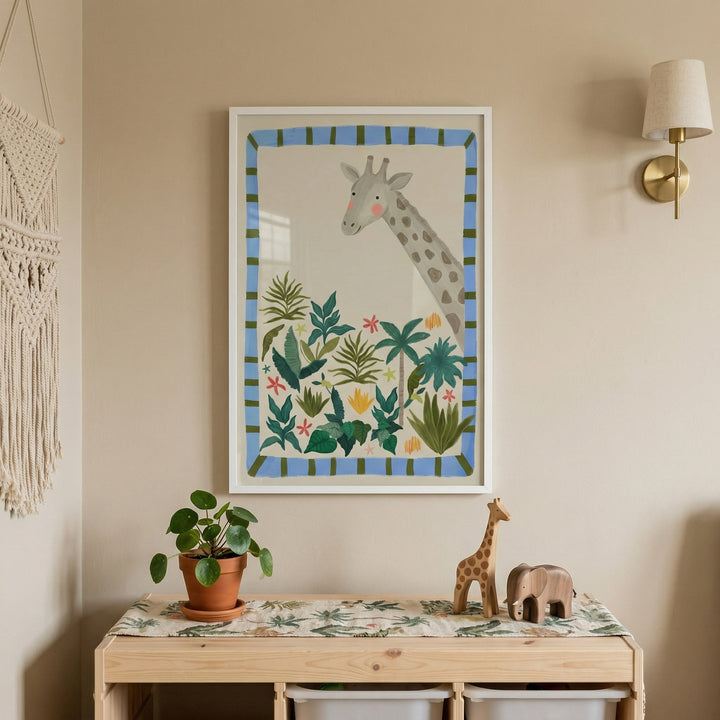 Warm nursery corner with a wooden table, potted plant, and small animal toys beneath a framed illustration of a gentle giraffe peeking over lush green plants and colorful flowers. The soft tones and playful artwork create a calm and nature inspired focal point in the space.