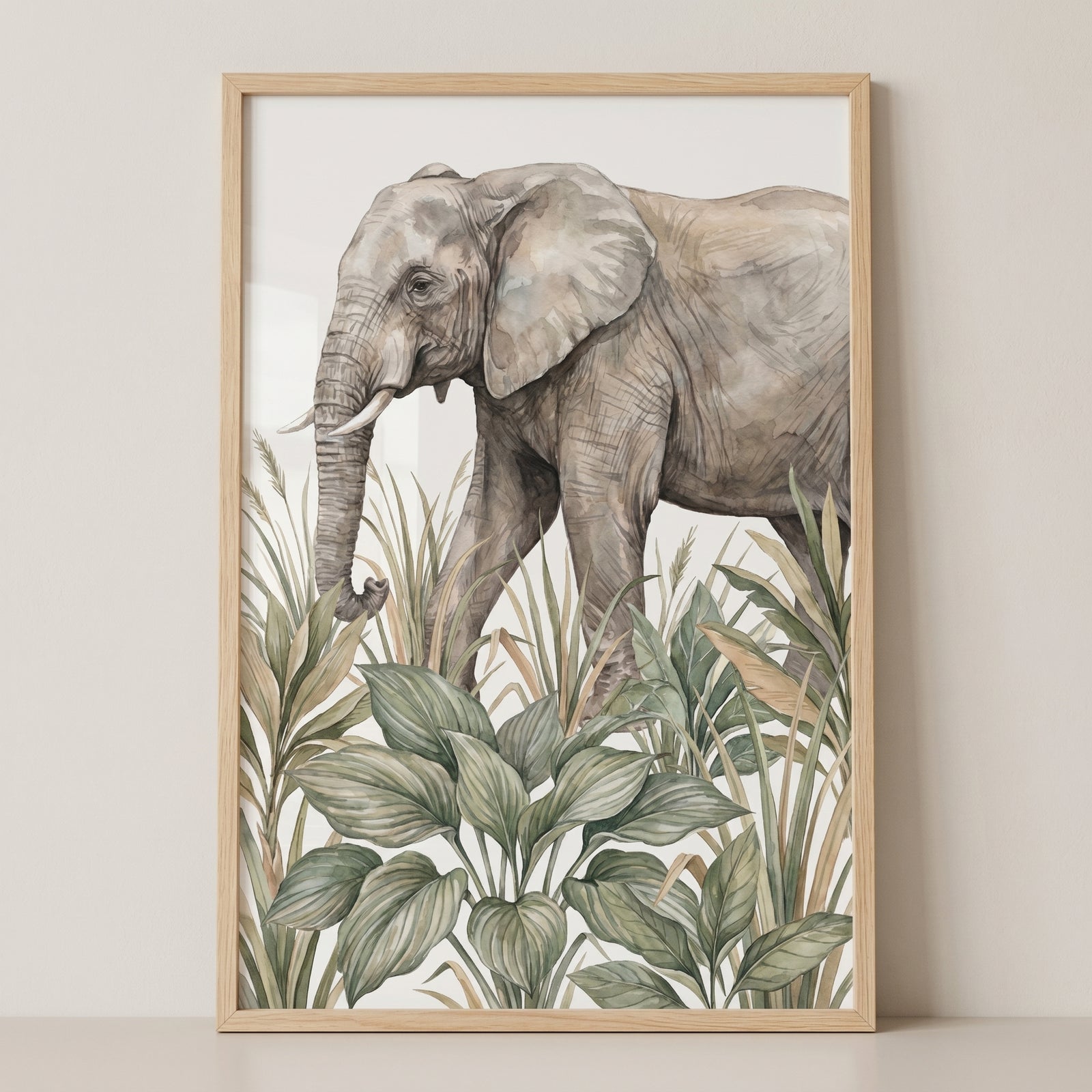 Tropical jungle elephant wall art with a grey elephant walking through lush green plants and grass in a light wood frame.