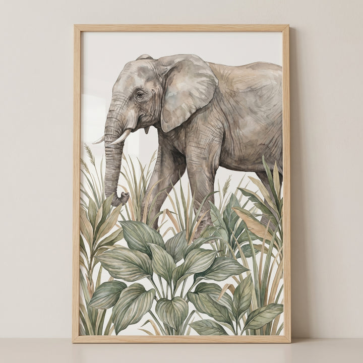 Tropical jungle elephant wall art with a grey elephant walking through lush green plants and grass in a light wood frame.