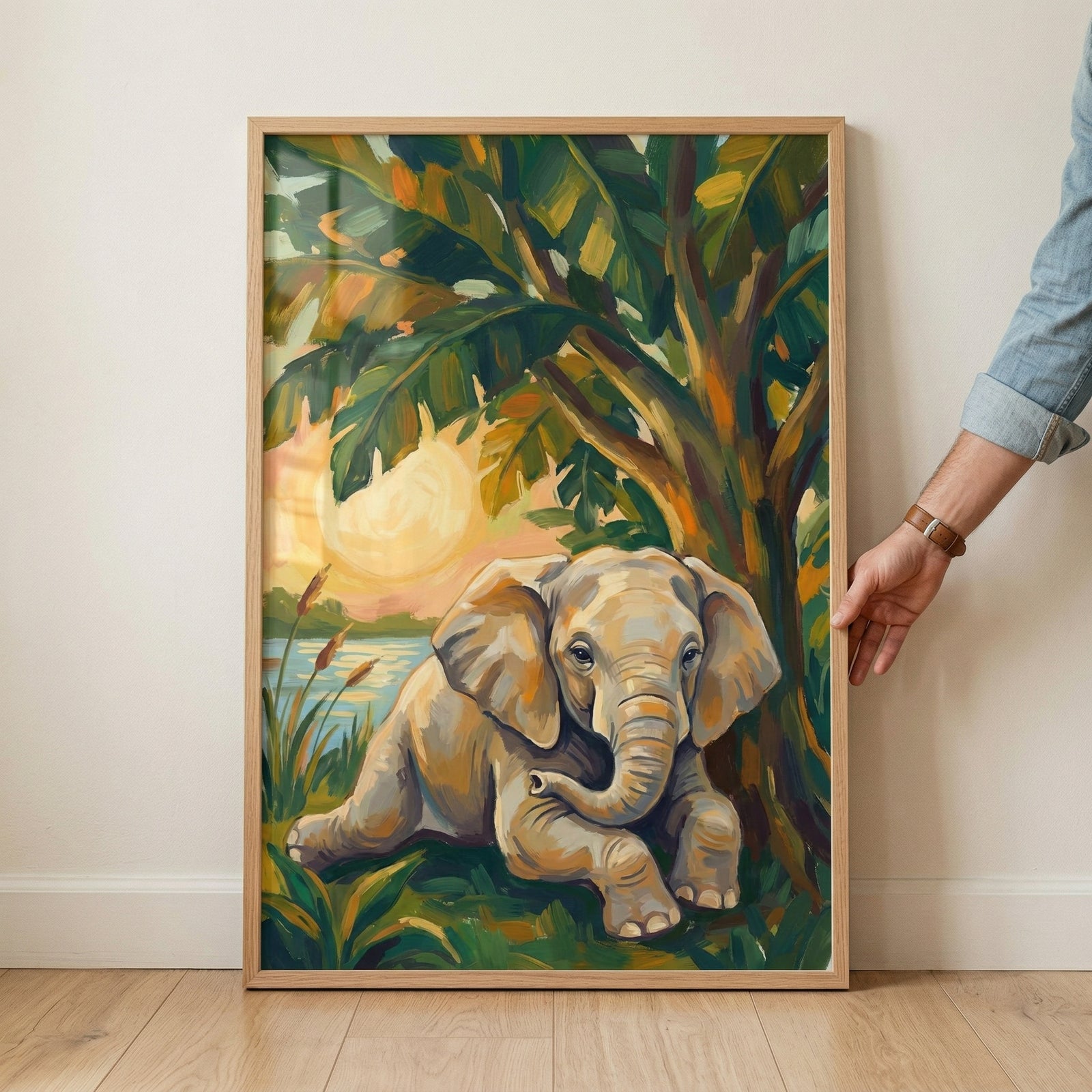 A vertical framed illustration captures a young elephant resting peacefully beneath the shade of a tropical tree with large, broad leaves. The artwork is characterized by bold, textured brushstrokes in a vibrant palette of emerald green, warm orange, and golden yellow. 