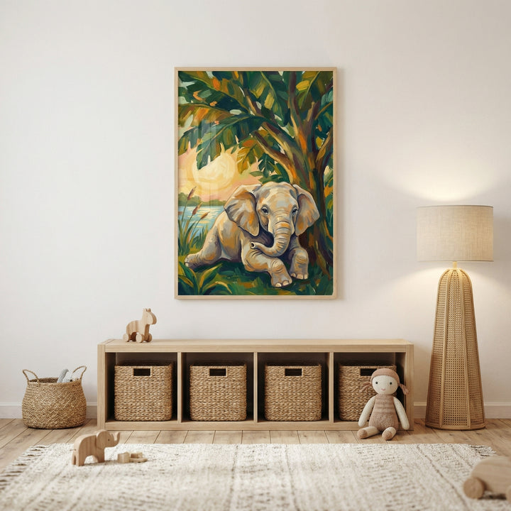 A warm and inviting nursery is decorated in neutral earth tones. Centered on the light-colored wall is a large, vertically-oriented framed illustration. This artwork depicts a young grey elephant sitting contentedly beneath a large tree with vibrant green and orange leaves. In the background, a warm sun glows above a calm body of water.