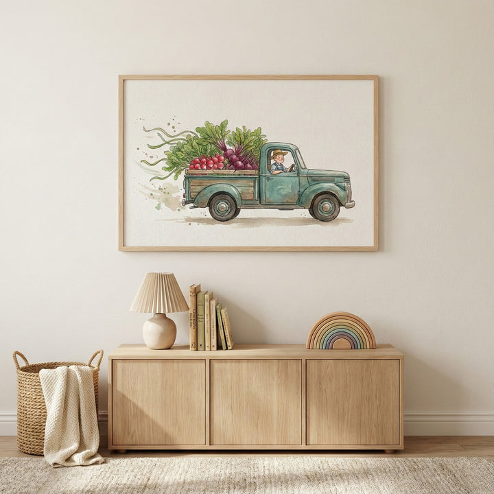 Framed farm truck print featuring a teal vintage truck loaded with vibrant vegetables, displayed in a softly styled room with natural wood furniture. The colorful and whimsical art adds a playful farmhouse touch to the decor.