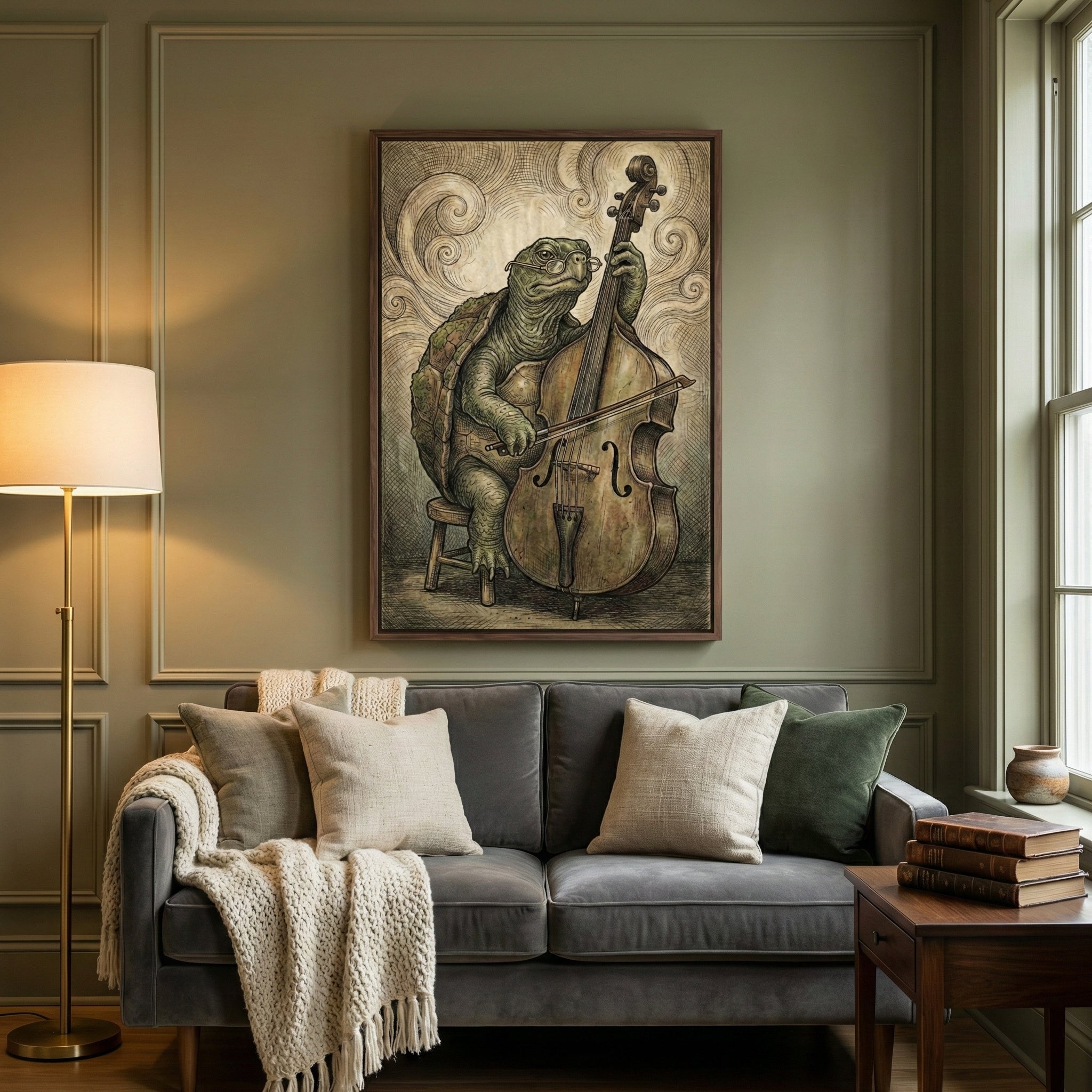 Elegant living room with a framed illustration of a turtle wearing glasses, seated on a stool while playing a double bass with a bow. Swirling lines in the background create a classical, whimsical mood, and the art hangs above a plush gray sofa with neutral throw pillows, a knit blanket, and a warm floor lamp beside it.
