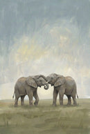 Two young elephants face each other, their trunks entwined playfully. The background is a pale, cloudy sky over grassy plains, adding a sense of innocence and joy.


