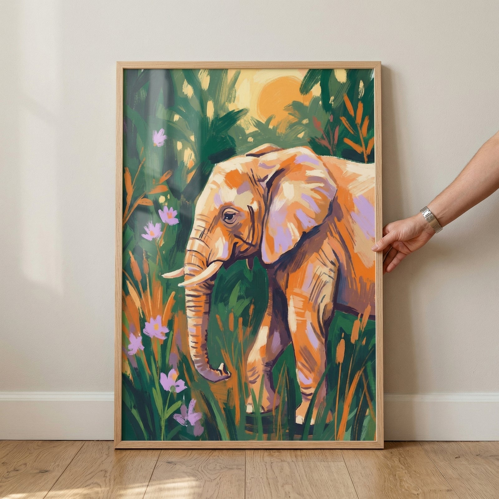 A vibrant and stylized artwork features an elephant walking through a lush, colorful environment. The elephant is depicted with bold, expressive strokes in shades of orange, peach, and hints of lavender. It stands amidst tall stalks of grass and small purple flowers.