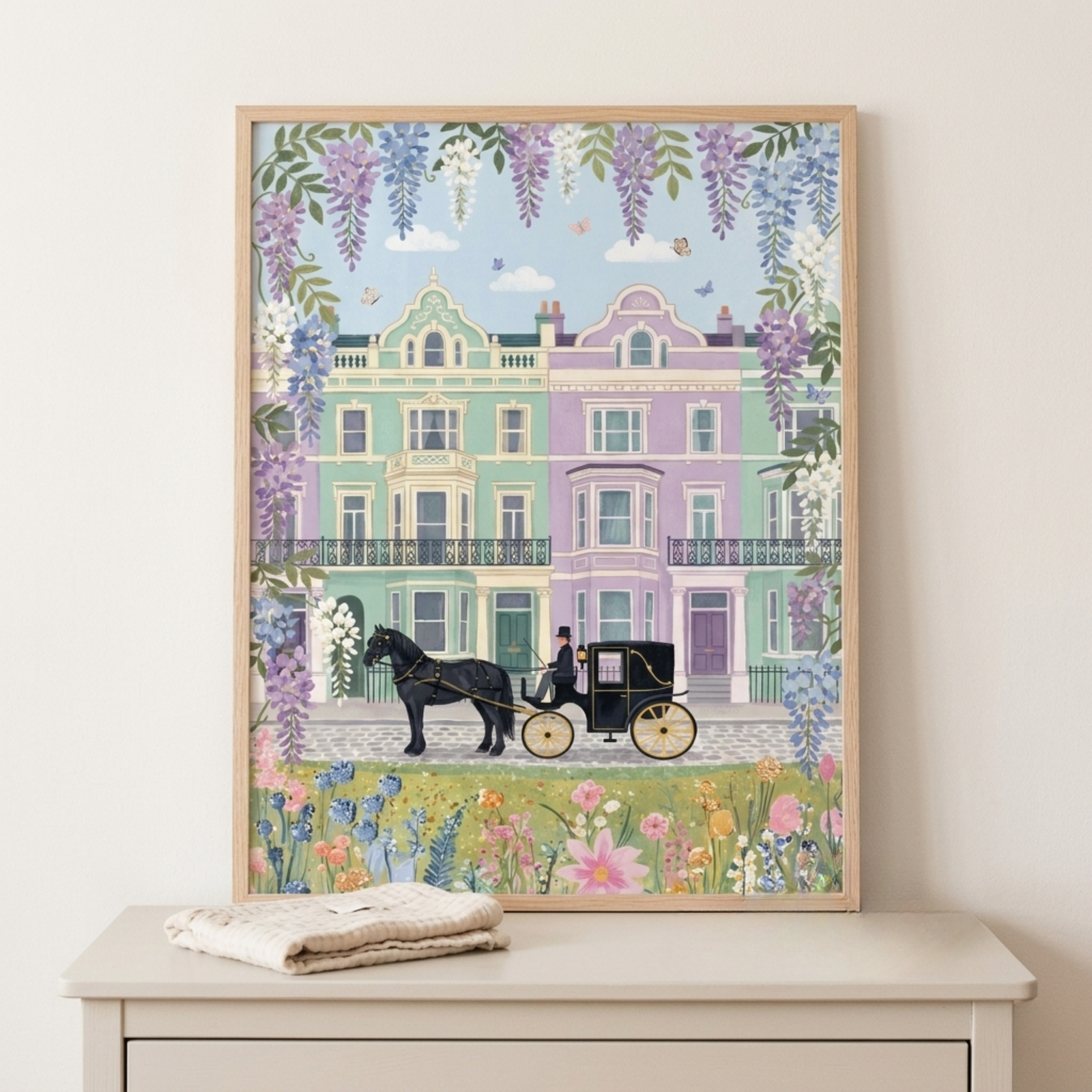A framed illustration of pastel colored townhouses with ornate details, a black horse pulling a carriage along the street, and flowers and hanging wisteria surrounding the scene under a soft blue sky.
