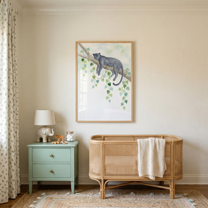 Vine jungle panther wall art hangs above a rattan crib and mint nightstand with an elephant lamp in a neutral nursery.