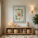 Playful nursery scene with a wooden storage unit, woven baskets, and colorful toys beneath a framed illustration of a smiling monkey hanging from a vine surrounded by green leaves and small flowers. The cheerful artwork adds a fun and lively focal point to the warm, child friendly space.