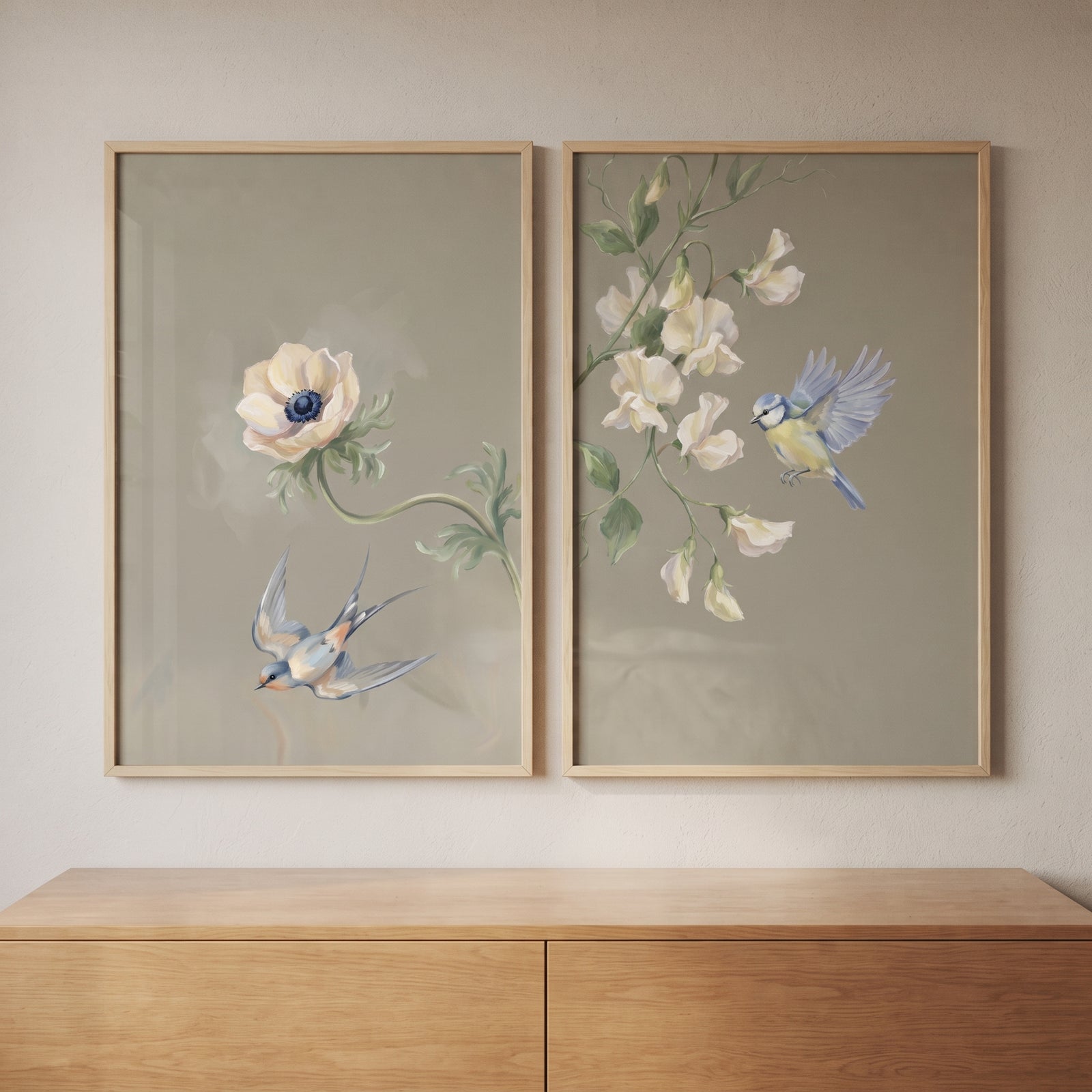 Vintage blue garden songbird wall art set of 2 above a wooden dresser with birds and white flowers on sage backgrounds.