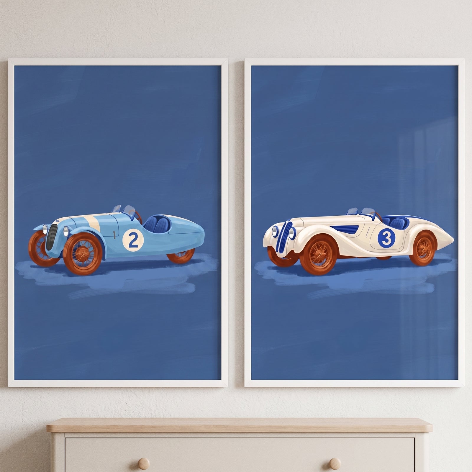 Vintage blue racing car wall art set of 2 with classic cars numbered 2 and 3 against blue backgrounds in white frames.