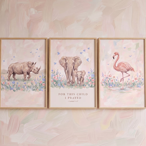Vintage charm savanna animals wall art set of 3 featuring a rhino, elephants, and a flamingo in soft pink floral fields.
