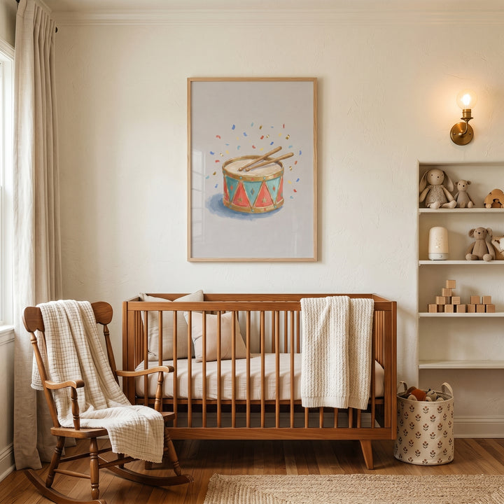 Vintage circus toy drum wall art hangs above a wooden crib in a neutral nursery with a rocking chair and toy shelves.