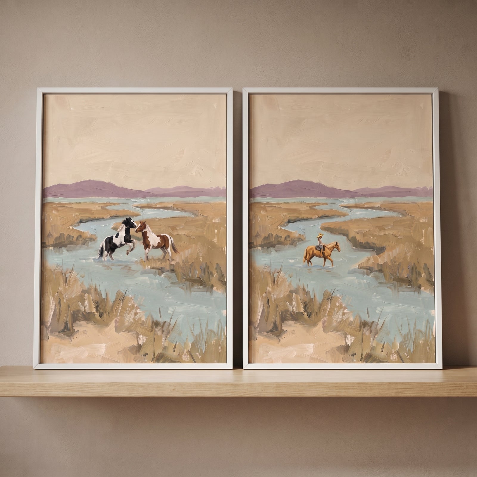 Vintage coastal marshland horses artwork set of 2 in white frames on a wooden shelf, depicting horses in a winding stream.