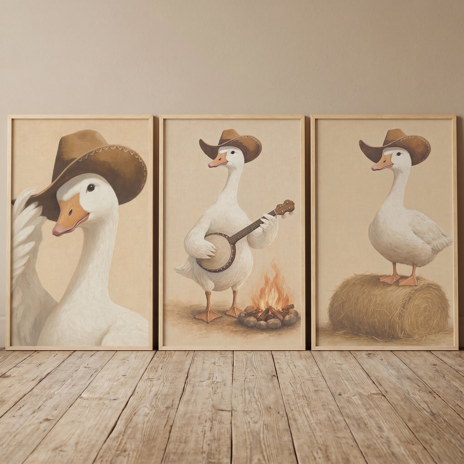 Vintage country cowboy goose wall art set of 3 with geese tipping a hat, playing a banjo, and on a hay bale.