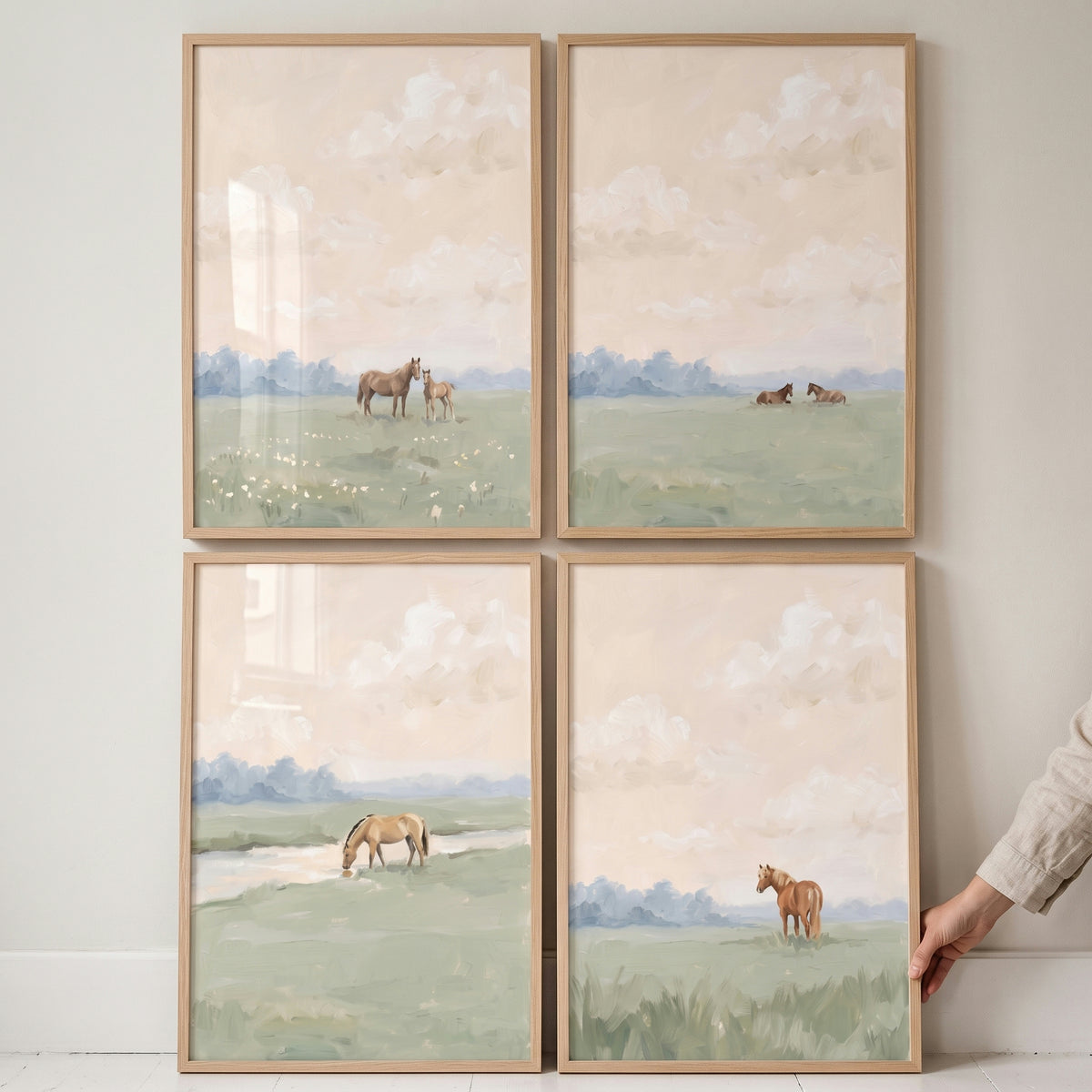Vintage country pasture horse wall art set of 4 in light wood frames, showing horses in soft, muted watercolor landscapes.