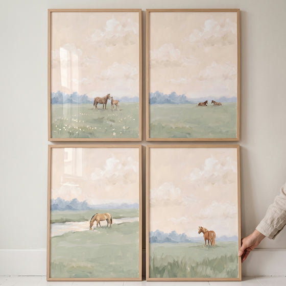 Vintage country pasture horse wall art set of 4 in light wood frames, showing horses in soft, muted watercolor landscapes.