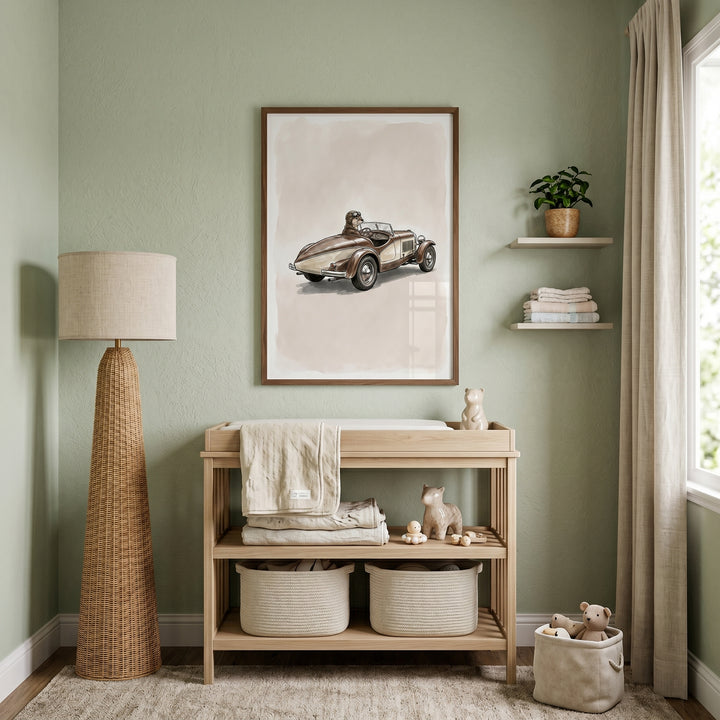Wooden changing table below vintage goggles driving otter wall art in a sage green nursery with a tall woven floor lamp.