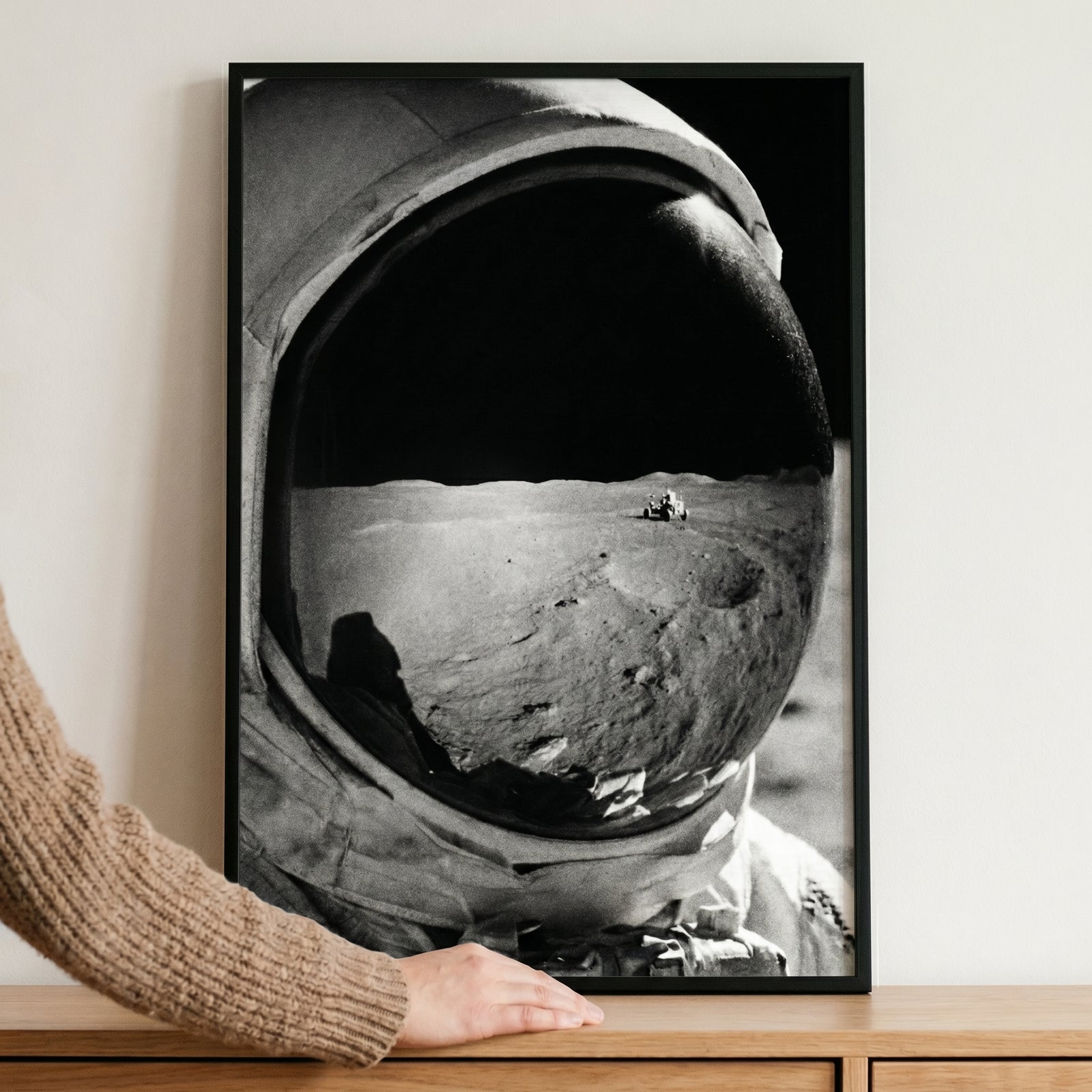 Framed vintage lunar landing astronaut wall art shows a lunar rover reflection in a helmet visor.