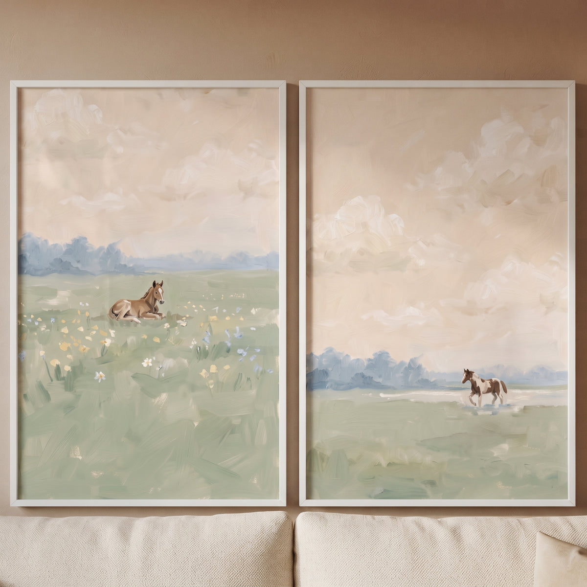 Vintage pastoral meadow horse wall art set of 2 shows horses in muted green fields under soft, cloudy skies.