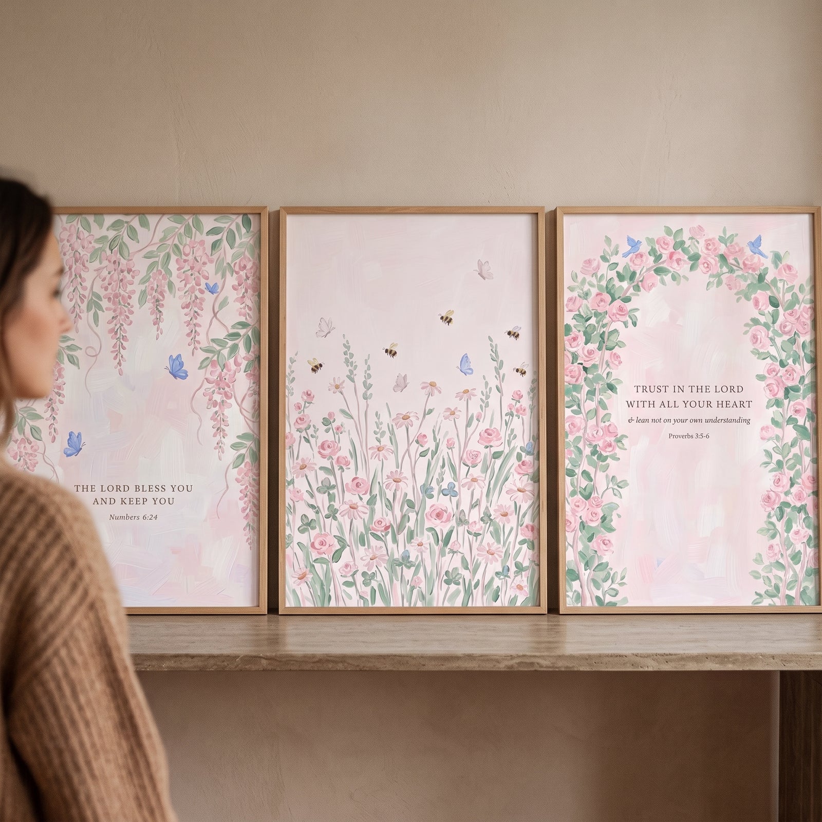 Vintage pink botanical garden wall art set of 3 featuring floral designs and bible verses on a wooden shelf.