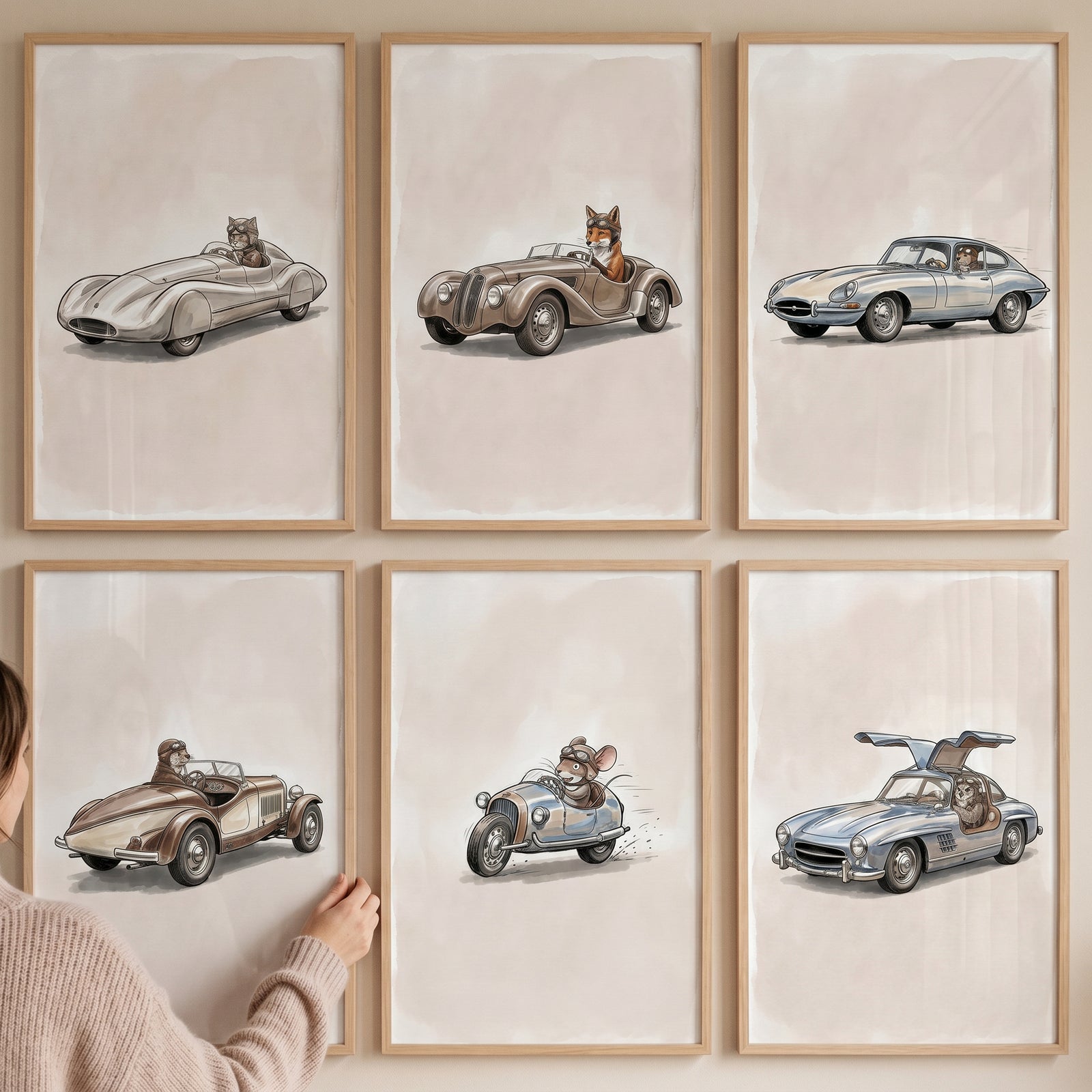 A person adjusts a vintage racing animal car wall art set of 6 featuring animals driving classic cars in wooden frames.