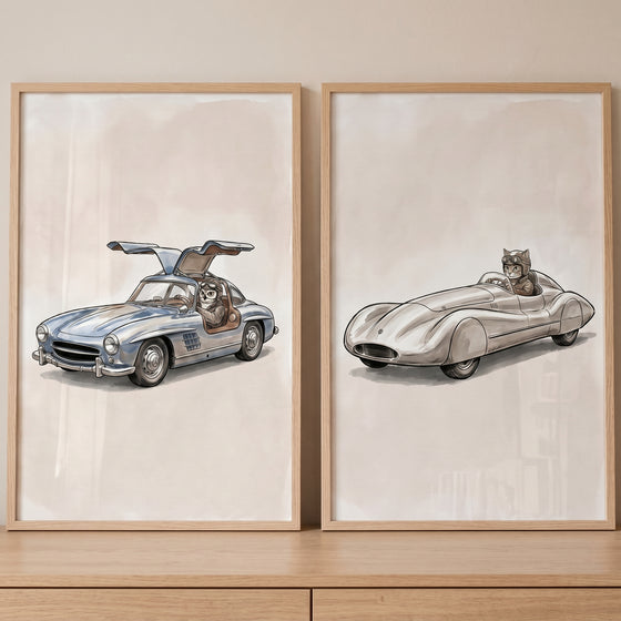 Vintage racing car wall art set of 2 with an owl and a cat driving classic silver cars in wooden frames.