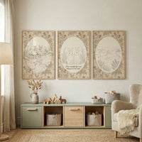 A neutral-toned room features three framed wall art pieces with sketch-like illustrations of generic rabbits in a vintage botanical style. The art displays rabbits in various natural settings, each framed by delicate floral borders.