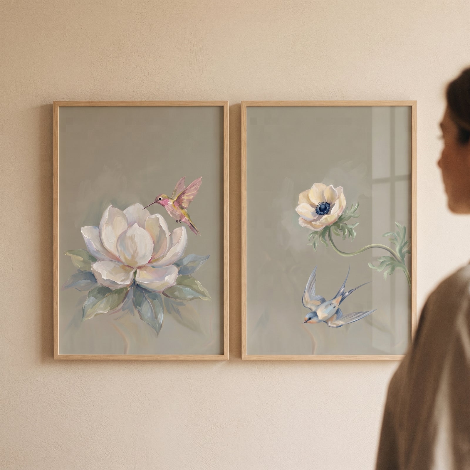 Vintage sage flying bird wall art set of 2 featuring a hummingbird and swallow with white flowers in wooden frames.
